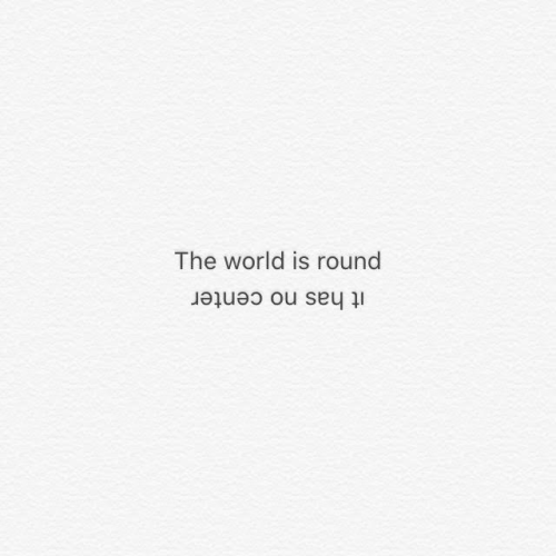 A concrete poem of the upright text 'The world is round' and the upside down text 'it has no center' on a pale textured background.